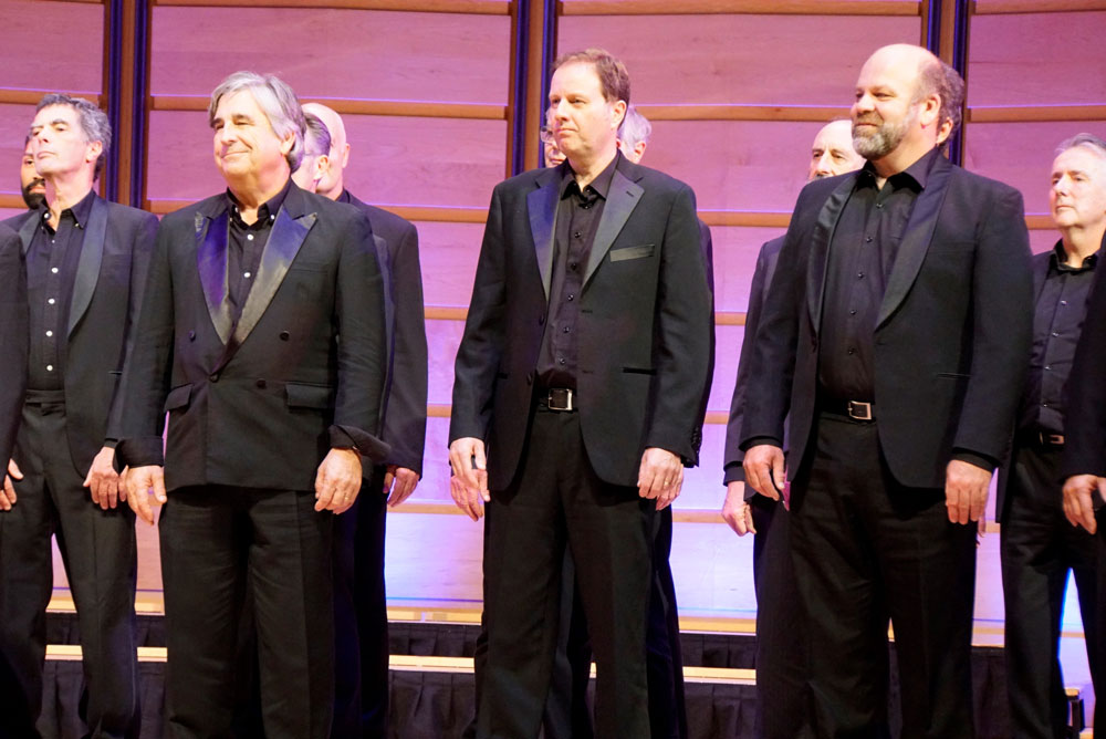 Close up of members of VoiceMale male choir performing at Sydney Recital Hall